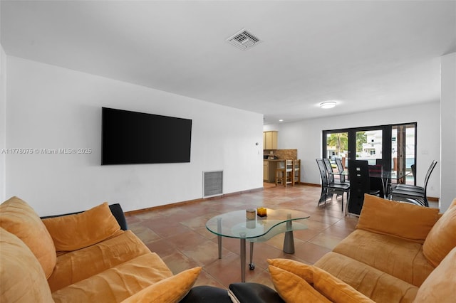 2447 SE 15th St, Pompano Beach, FL 33062 - living area with light tile patterned flooring, baseboards, and visible vents