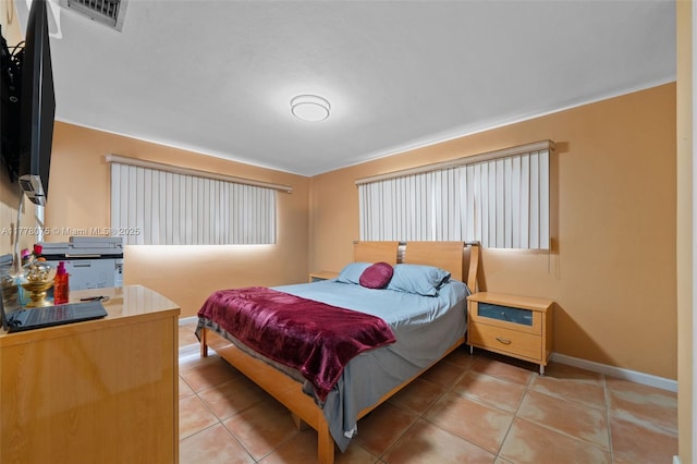 2447 SE 15th St, Pompano Beach, FL 33062 - bedroom with visible vents, baseboards, and light tile patterned floors