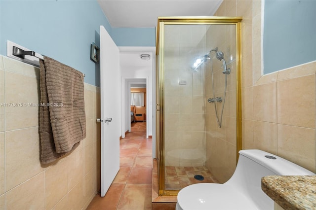 2447 SE 15th St, Pompano Beach, FL 33062 - full bath featuring toilet, a stall shower, tile patterned floors, and tile walls