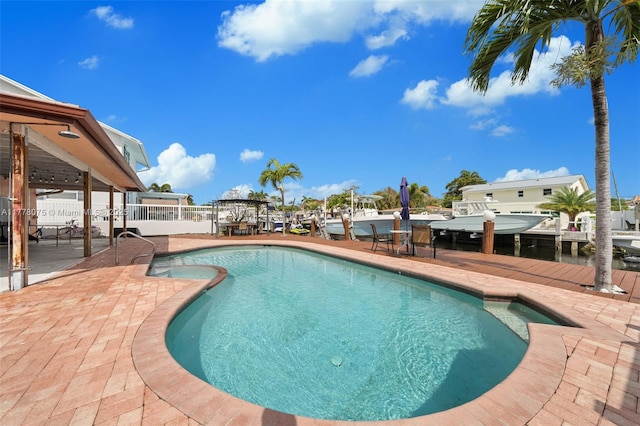 2447 SE 15th St, Pompano Beach, FL 33062 - view of pool featuring a fenced in pool, a patio, and a dock