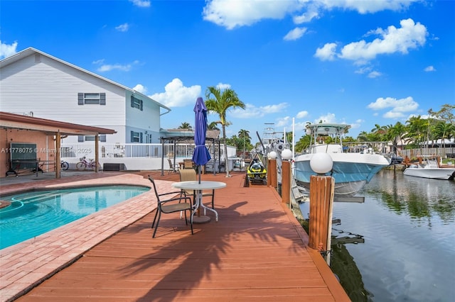 2447 SE 15th St, Pompano Beach, FL 33062 - exterior space with a fenced in pool, fence, and a water view