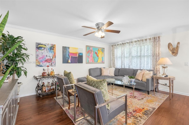 living room featuring a ceiling fan, baseboards, ornamental molding, and dark wood-style floors