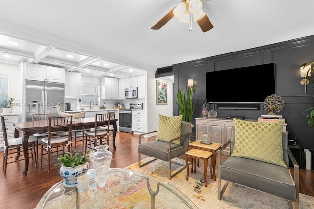 living room with beam ceiling, recessed lighting, light wood-style floors, coffered ceiling, and ceiling fan