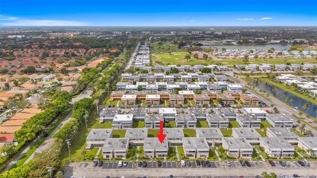drone / aerial view with a residential view and a water view
