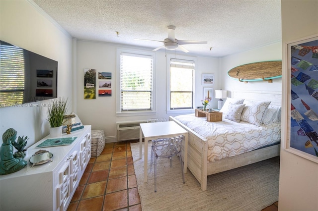 bedroom with ornamental molding, ceiling fan, and a textured ceiling