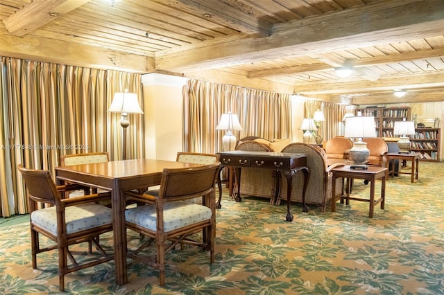 carpeted dining room featuring wood ceiling and beam ceiling