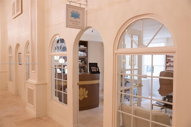 corridor with arched walkways and visible vents