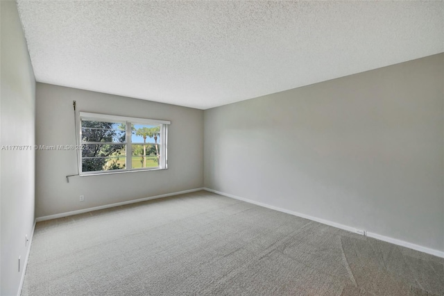 12701 SW 13th St Unit 301F, Pembroke Pines, FL 33027 - carpeted spare room featuring baseboards and a textured ceiling