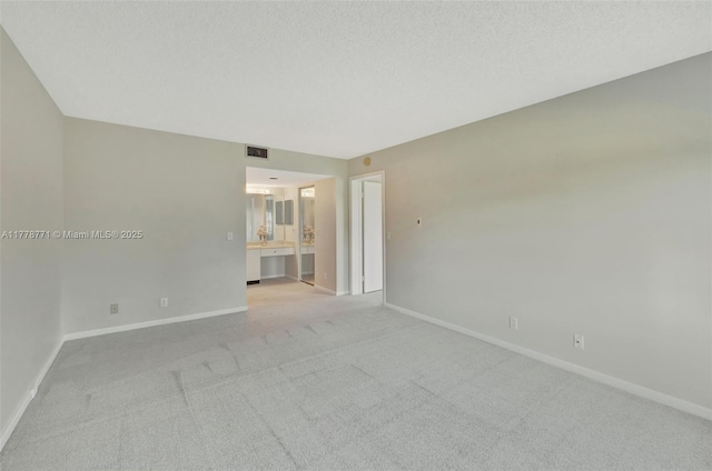12701 SW 13th St Unit 301F, Pembroke Pines, FL 33027 - unfurnished room featuring visible vents, light colored carpet, and baseboards