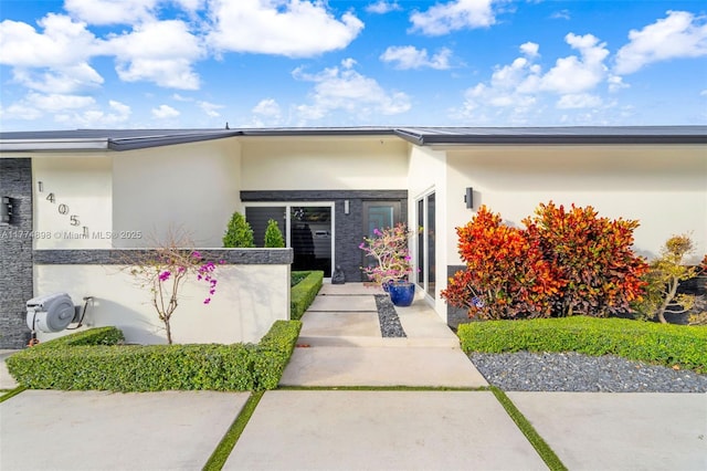 view of front of house featuring stucco siding