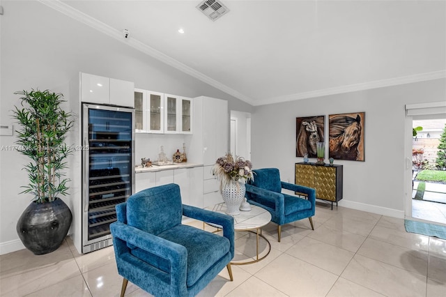 living area with vaulted ceiling, visible vents, beverage cooler, and ornamental molding