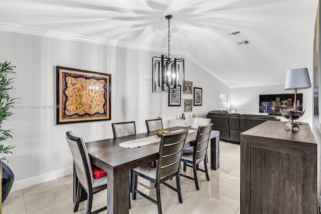 dining room featuring a notable chandelier, vaulted ceiling, ornamental molding, and visible vents