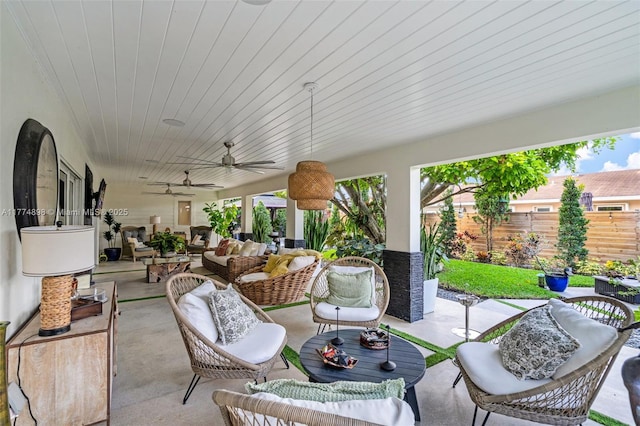 view of patio with ceiling fan, fence, and an outdoor hangout area