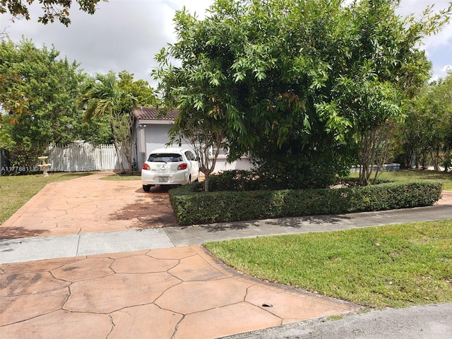 10041 SW 14th Ter, Miami, FL 33174 - obstructed view of property featuring concrete driveway and stucco siding