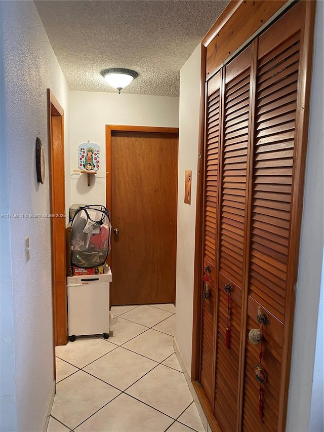 10041 SW 14th Ter, Miami, FL 33174 - hallway featuring light tile patterned flooring and a textured ceiling