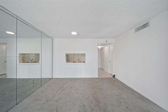 6545 Indian Creek Dr Unit 505, Miami Beach, FL 33141 - empty room featuring carpet flooring and a textured ceiling
