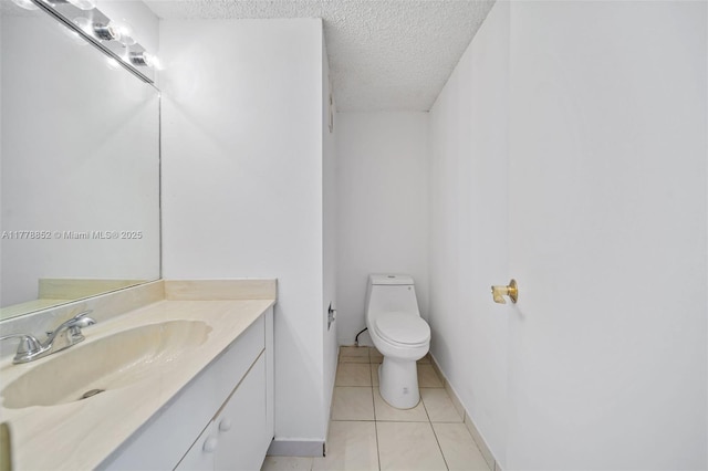6545 Indian Creek Dr Unit 505, Miami Beach, FL 33141 - half bath with a textured ceiling, tile patterned floors, toilet, vanity, and baseboards