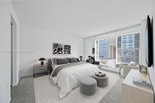 6545 Indian Creek Dr Unit 505, Miami Beach, FL 33141 - bedroom with carpet flooring and a textured ceiling