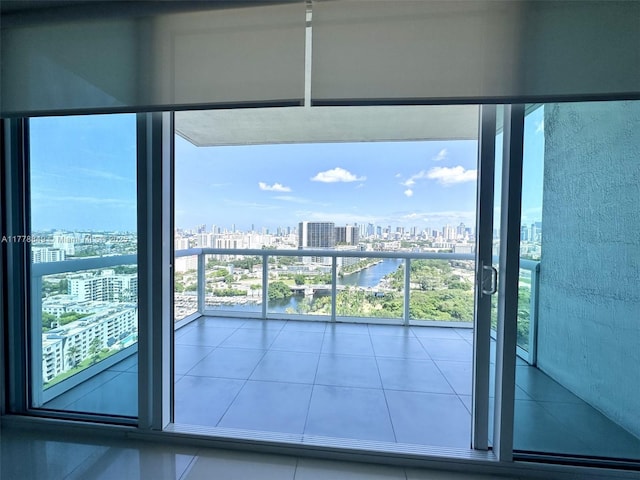 balcony with a water view and a city view