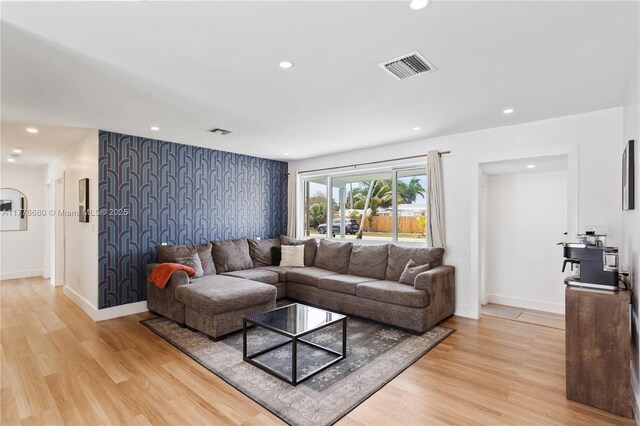 3710 NW 6th Ave, Deerfield Beach, FL 33064 - living area featuring light wood-type flooring, baseboards, recessed lighting, and an accent wall