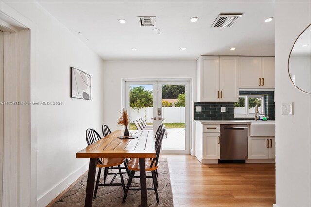 3710 NW 6th Ave, Deerfield Beach, FL 33064 - dining room with french doors, recessed lighting, light wood-style flooring, and baseboards