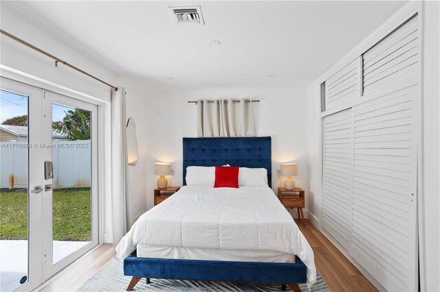 3710 NW 6th Ave, Deerfield Beach, FL 33064 - bedroom featuring access to outside and light wood finished floors