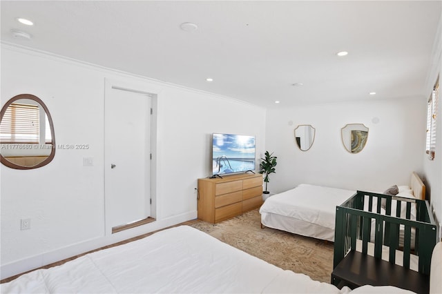 bedroom with recessed lighting, ornamental molding, and wood finished floors