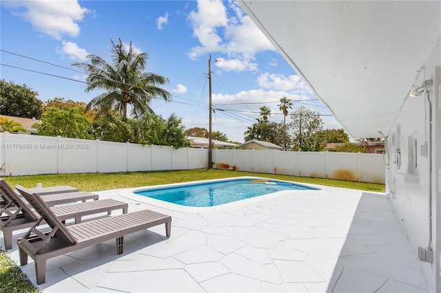 view of swimming pool with a patio, a fenced in pool, and a fenced backyard