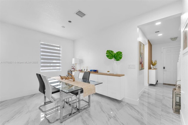 dining area with visible vents, baseboards, recessed lighting, and marble finish floor