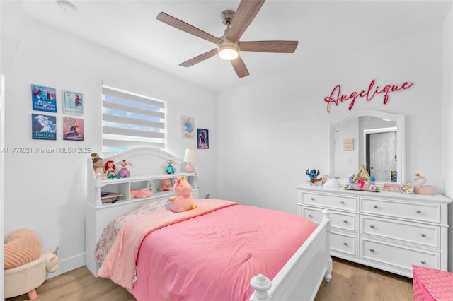 bedroom featuring light wood-style flooring and ceiling fan