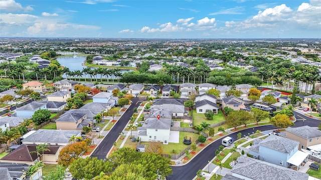 bird's eye view featuring a residential view and a water view