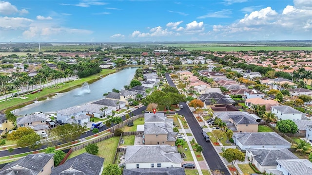 aerial view with a residential view and a water view