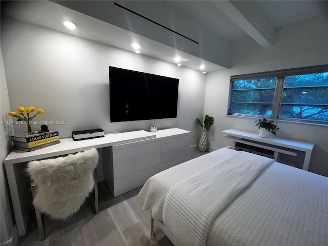 bedroom with recessed lighting and wood finished floors