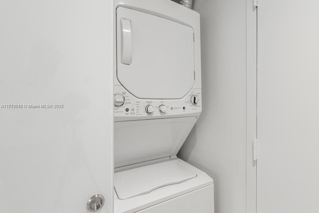 laundry room with laundry area and stacked washer / drying machine