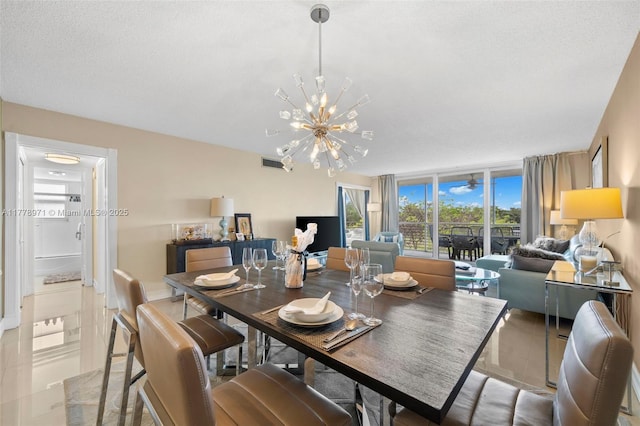 dining space with a notable chandelier and visible vents