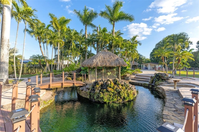 surrounding community with a water view