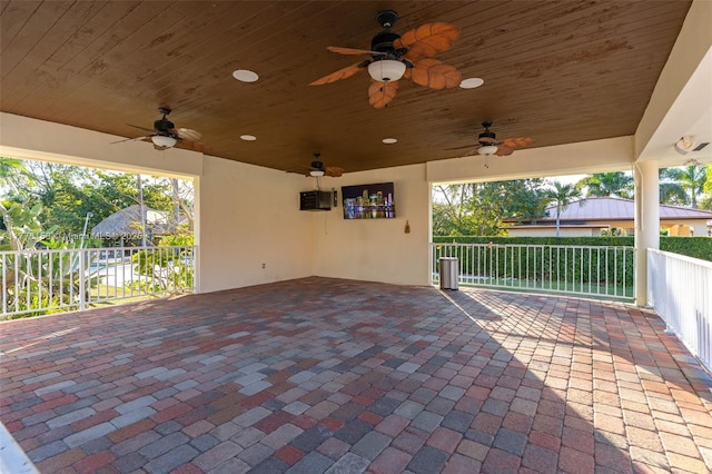 view of patio / terrace with a ceiling fan and fence