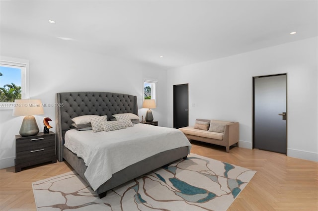 bedroom featuring baseboards, multiple windows, and recessed lighting
