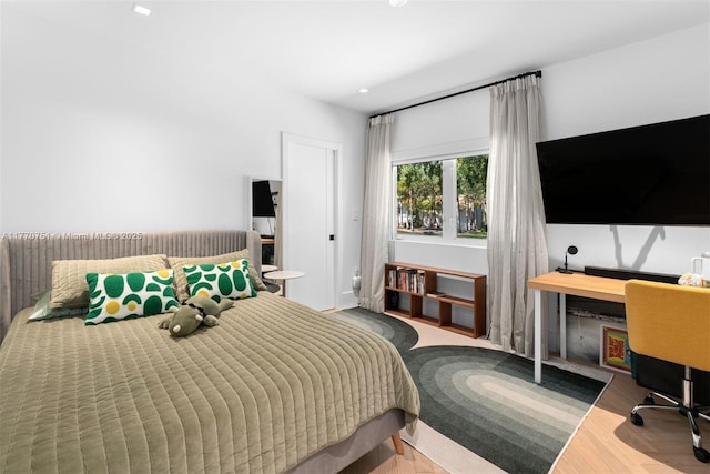 bedroom with wood finished floors