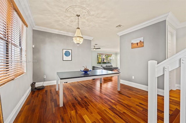 game room with ornamental molding, visible vents, baseboards, and wood finished floors