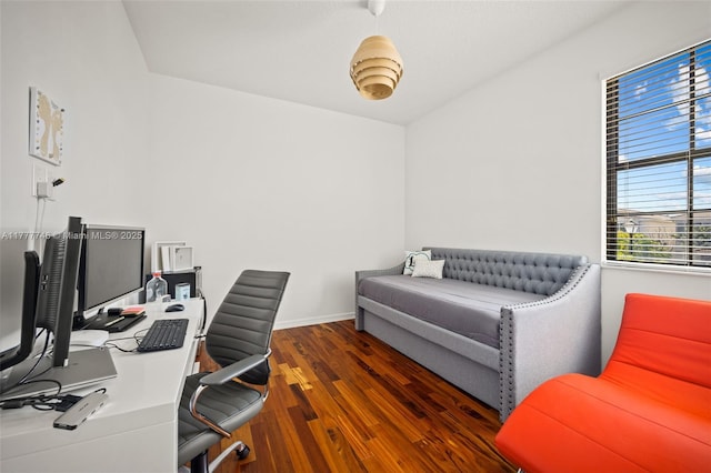 home office with baseboards and wood finished floors