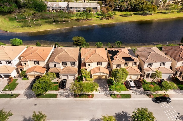 bird's eye view featuring a water view and a residential view