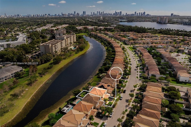 drone / aerial view with a water view and a city view
