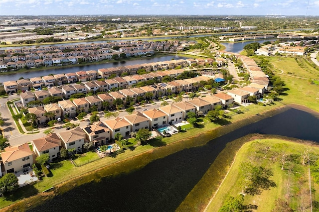 birds eye view of property featuring a water view and a residential view