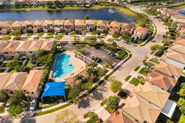 aerial view with a water view and a residential view