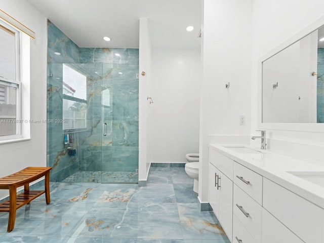 bathroom with baseboards, a sink, toilet, a shower stall, and double vanity