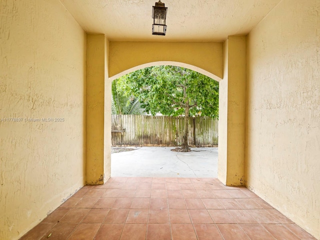 view of patio / terrace featuring fence