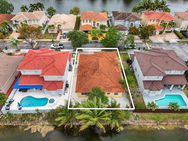 aerial view with a water view and a residential view