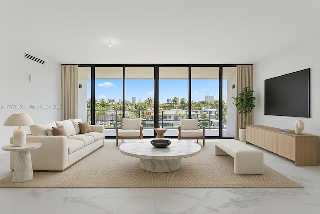 160 Isle Of Venice Dr Unit Ph2, Fort Lauderdale, FL 33301 - living area with a healthy amount of sunlight, marble finish floor, floor to ceiling windows, and visible vents