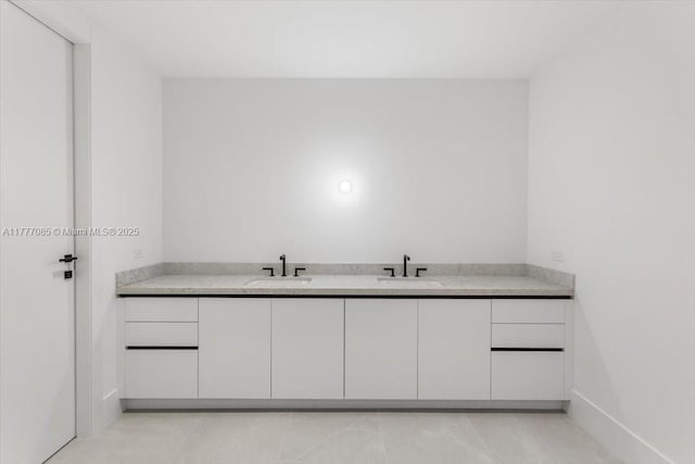 160 Isle Of Venice Dr Unit Ph2, Fort Lauderdale, FL 33301 - bathroom with tile patterned floors, a sink, and baseboards